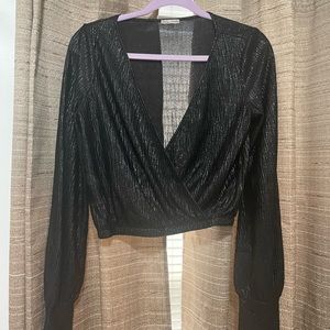 Black shining material, wore once, low cut.